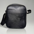 Black pebbled leather crossbody messenger bag with an adjustable strap.