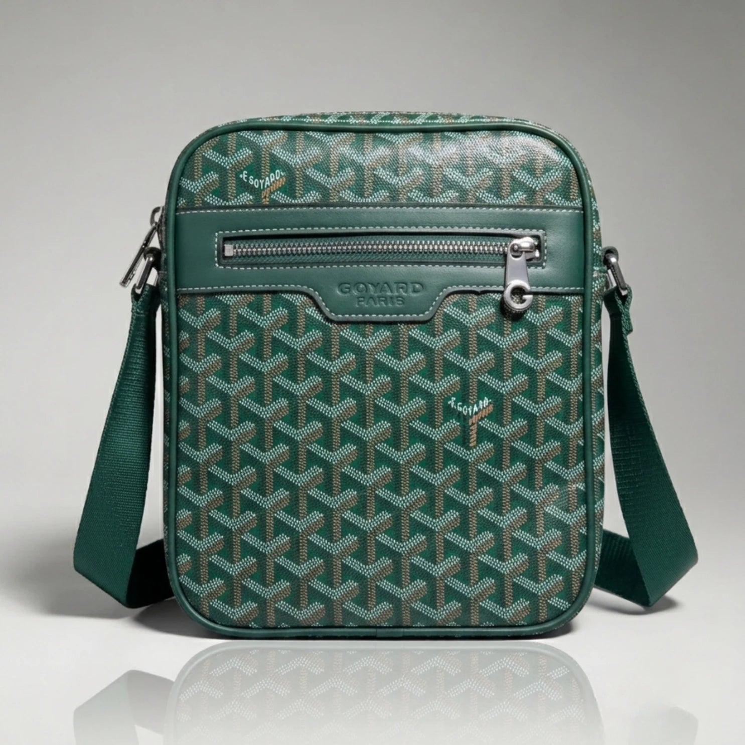 Goyard green Goyardine canvas crossbody bag with front zip pocket and adjustable strap.