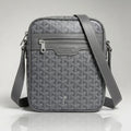 Goyard grey Goyardine canvas crossbody bag with front zip pocket and adjustable strap.