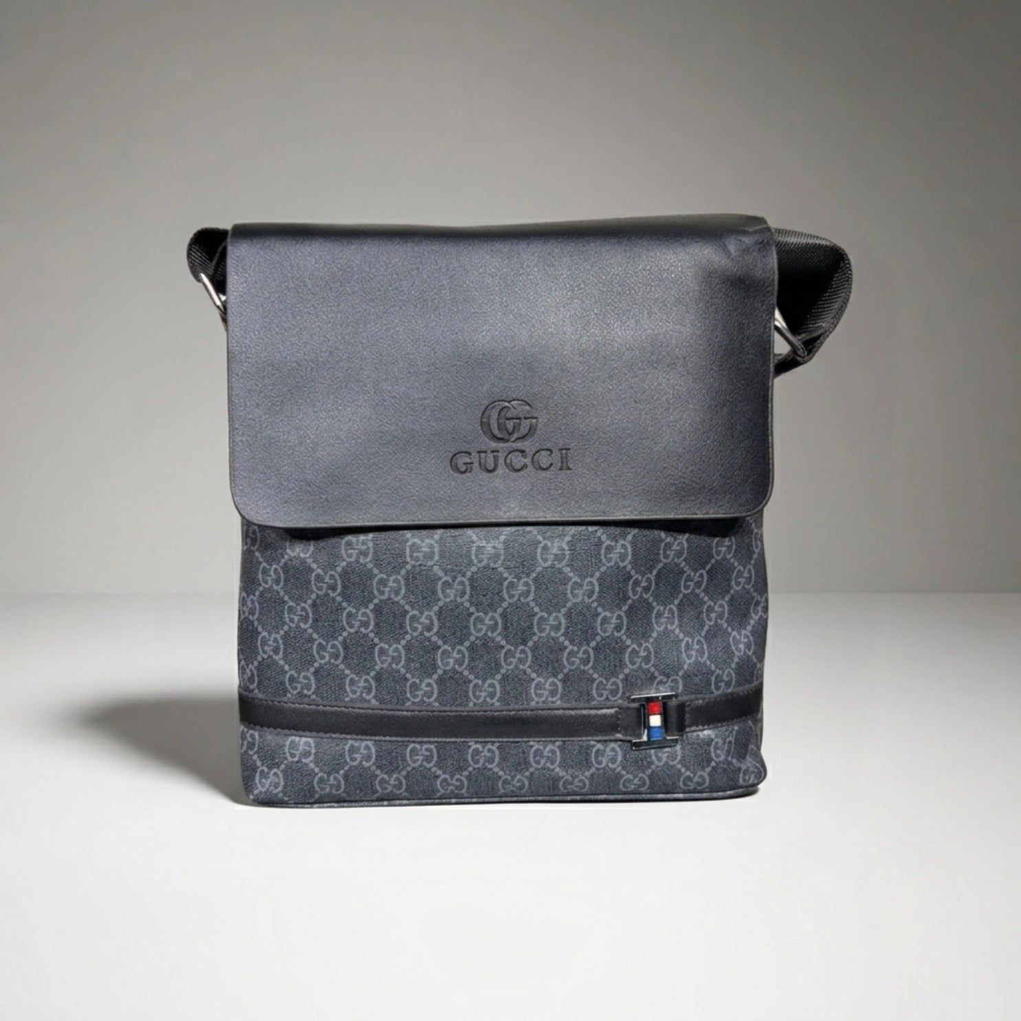 Gucci GG Supreme canvas flap messenger bag with embossed logo flap and shoulder strap.