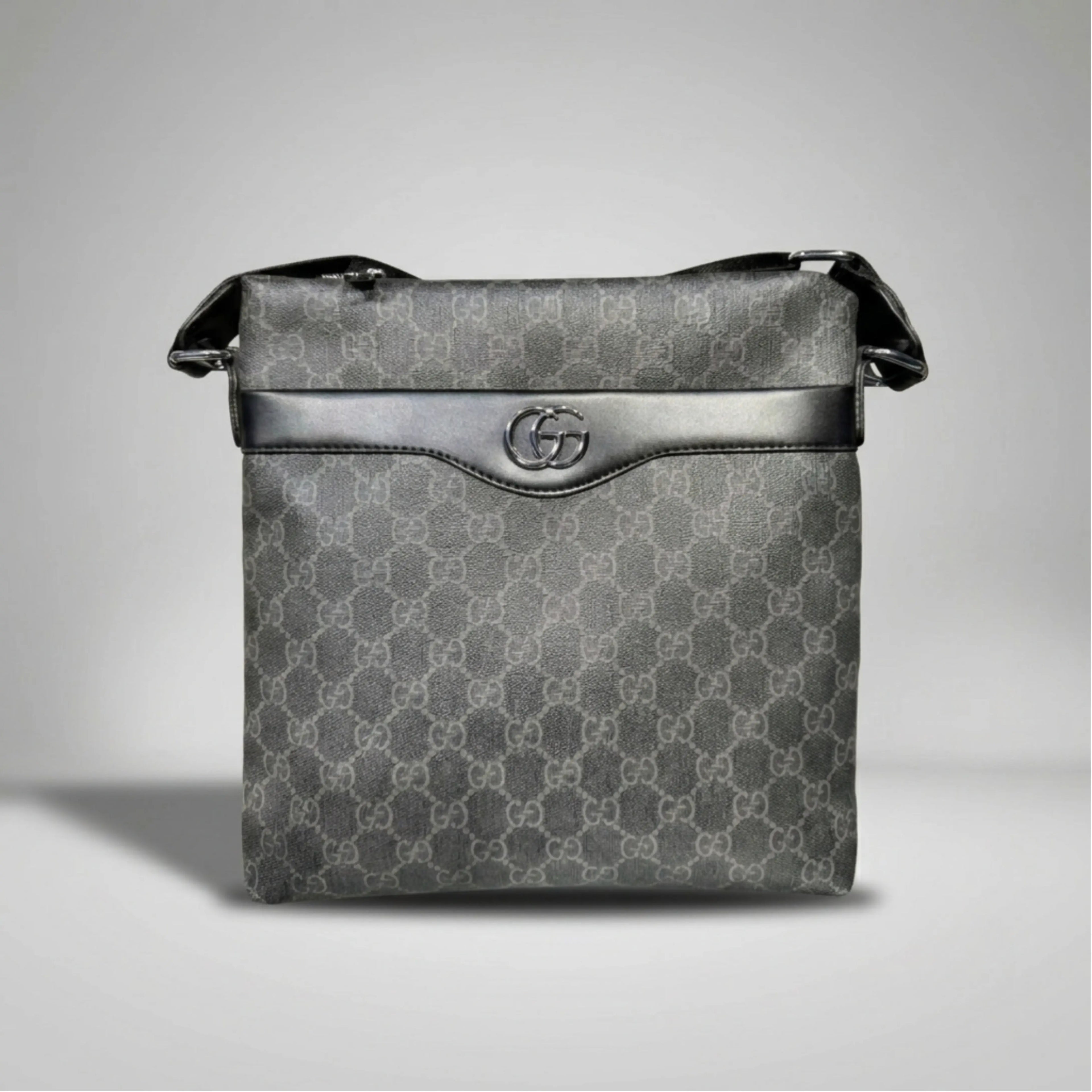 Gucci GG Supreme black canvas flat crossbody bag with leather trim and silver Double G emblem.