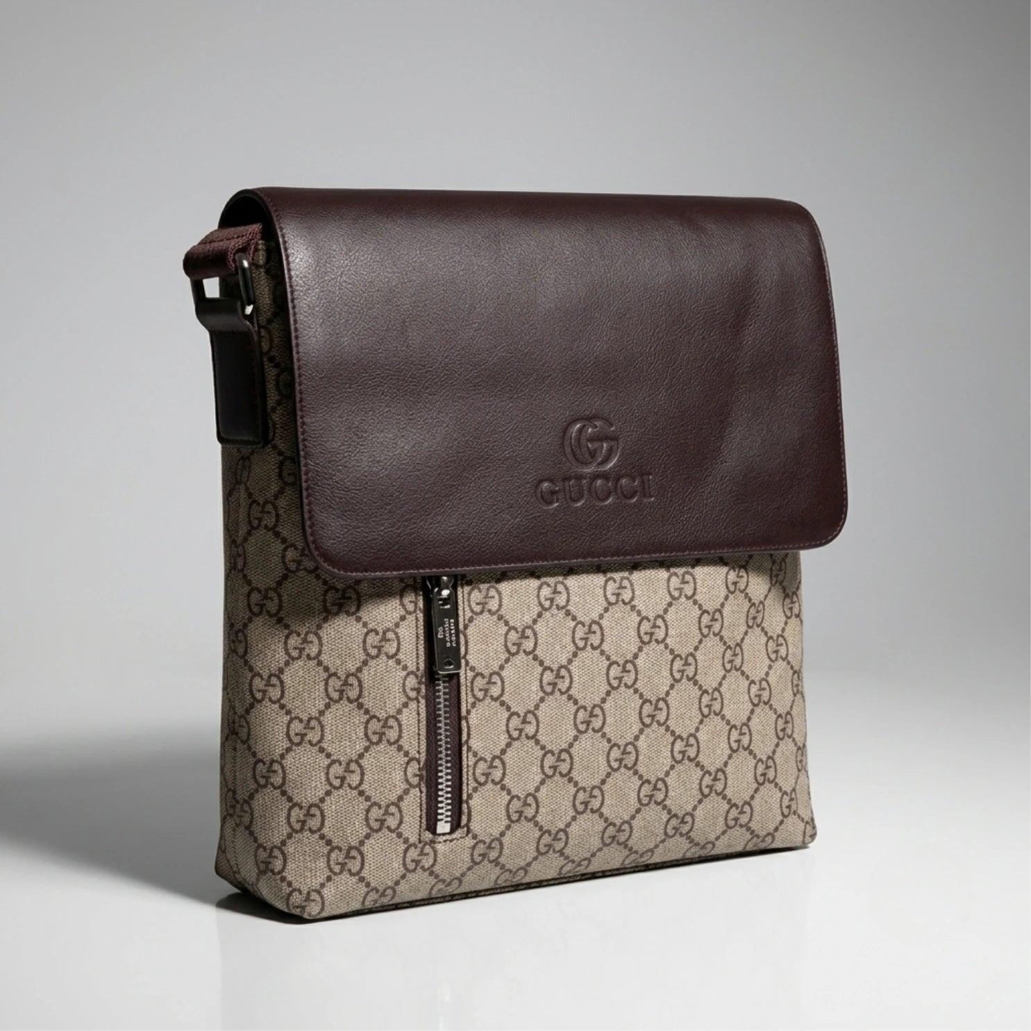 Gucci GG beige canvas flap messenger bag with brown leather flap and vertical zip pocket.
