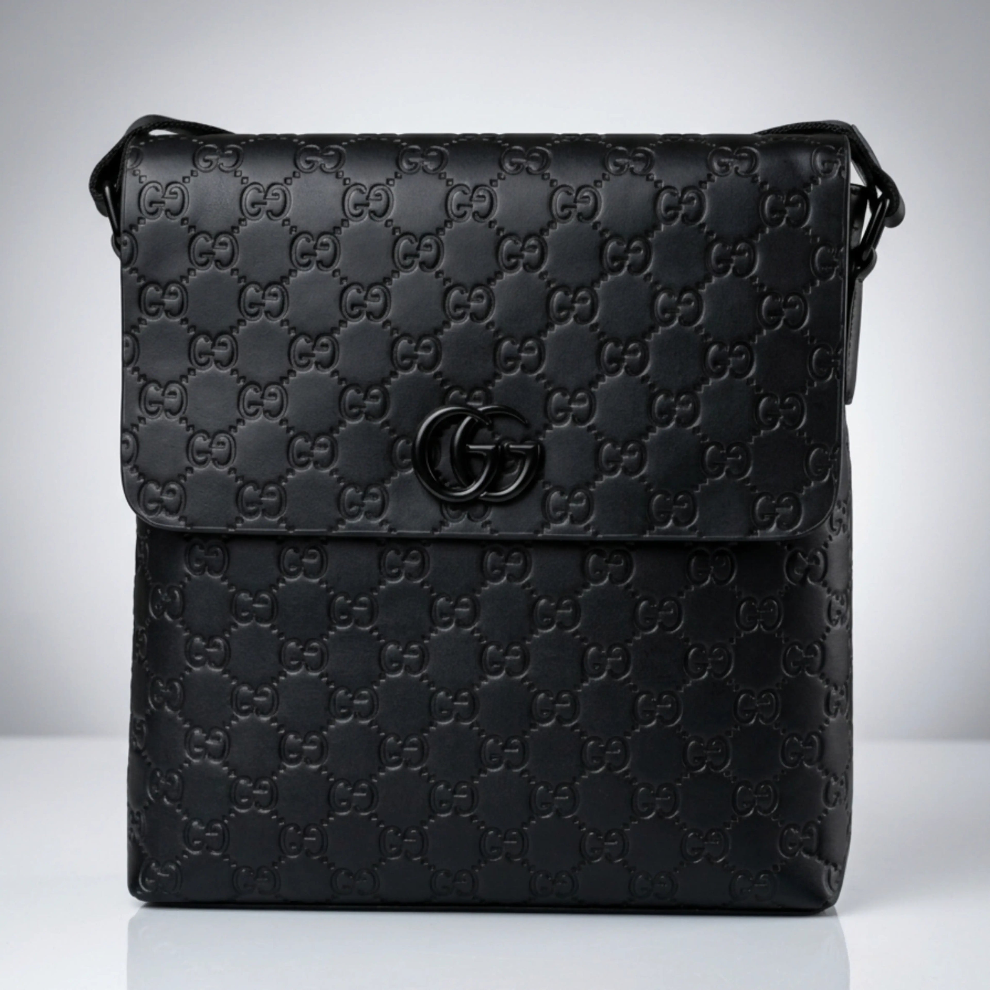 Gucci black Guccissima embossed leather flap messenger bag with matte black Double G emblem.