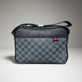 Louis Vuitton Damier Graphite canvas messenger bag with red accent D ring and shoulder strap.
