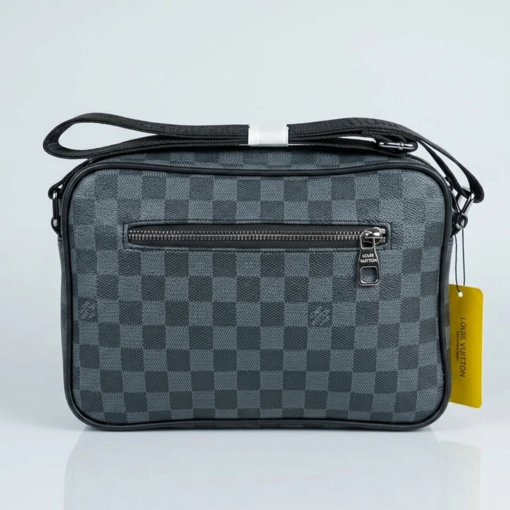 Louis Vuitton Damier Graphite canvas messenger bag with red accent D ring and shoulder strap.