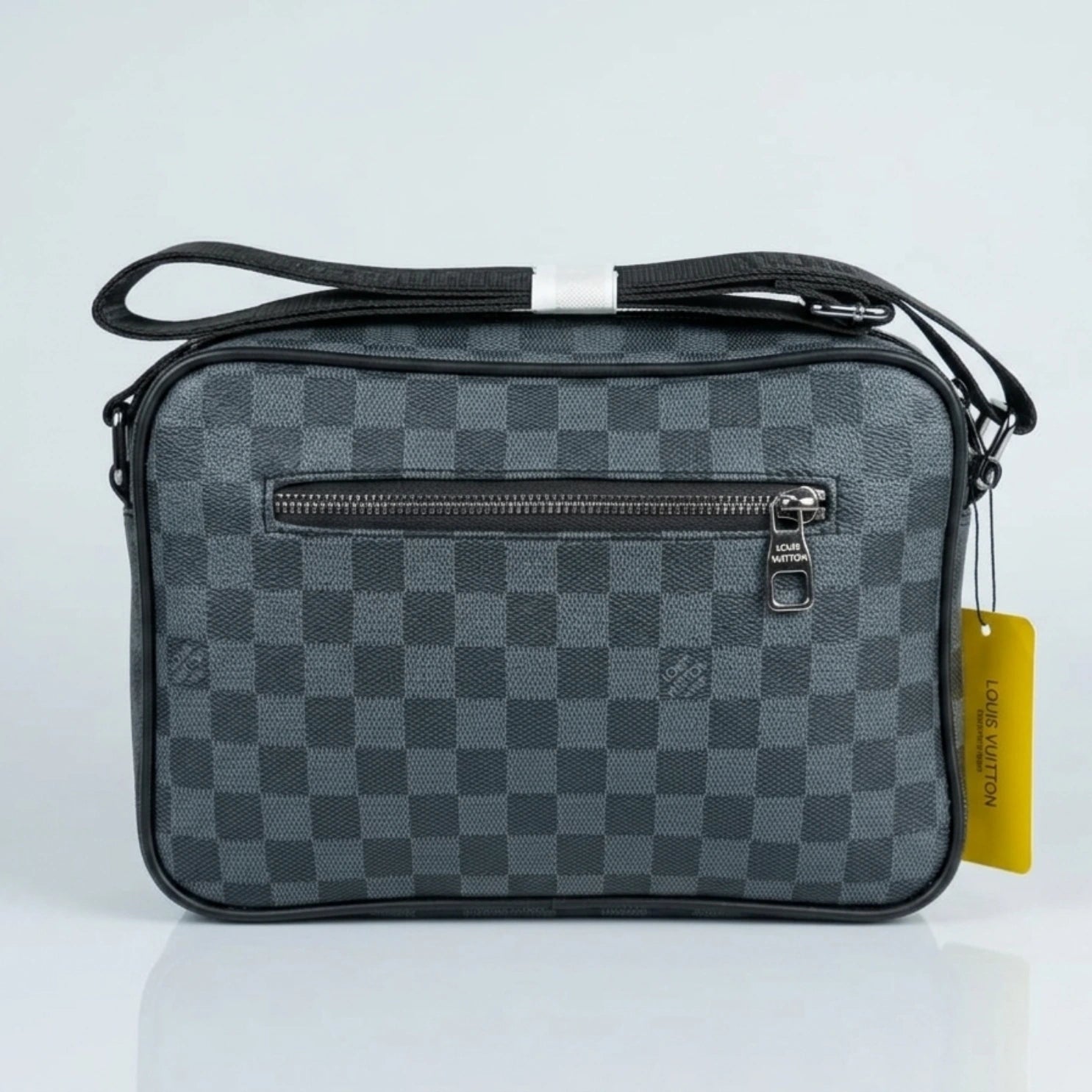 Louis Vuitton Damier Graphite canvas messenger bag with red accent D ring and shoulder strap.