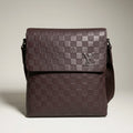 Louis Vuitton brown Damier Infini leather flap messenger bag with metallic logo plaque.