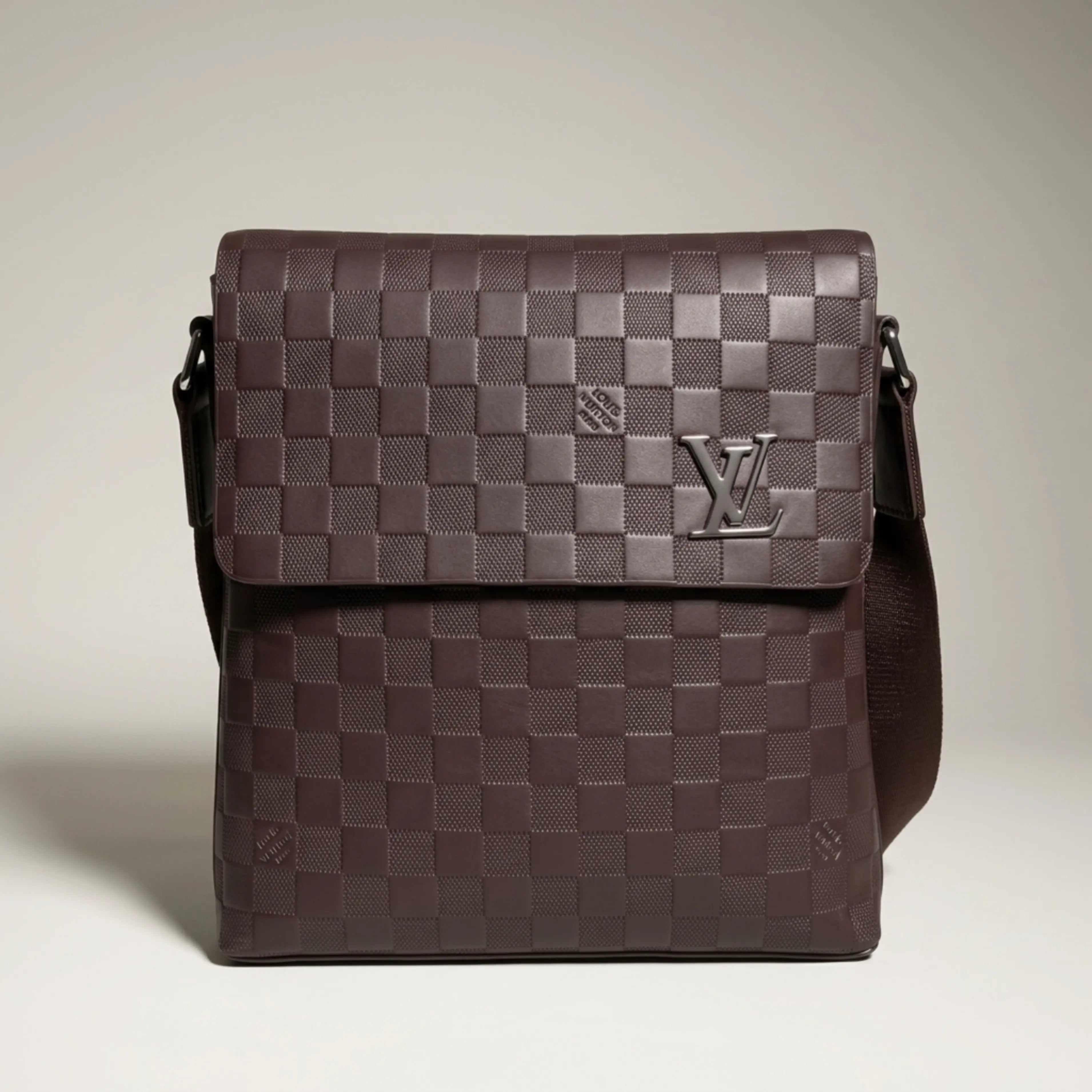 Louis Vuitton brown Damier Infini leather flap messenger bag with metallic logo plaque.