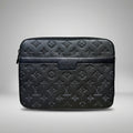 Louis Vuitton black Monogram Empreinte leather clutch bag with smooth leather trim band.