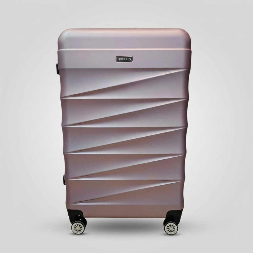 Unicare burgundy textured hard shell spinner trolley bag with geometric diagonal grooves.