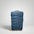Unicare burgundy textured hard shell spinner trolley bag with geometric diagonal grooves.