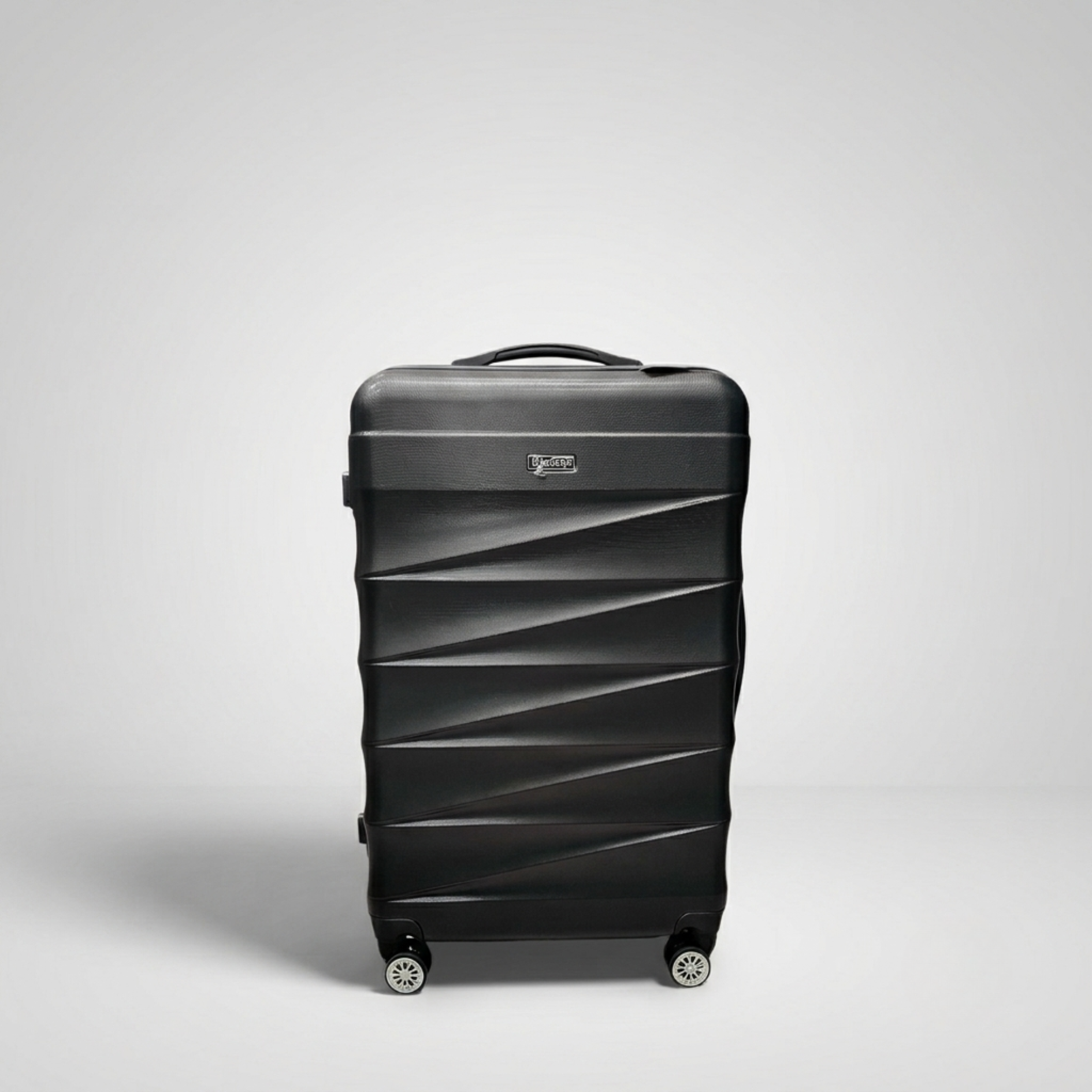 Unicare burgundy textured hard shell spinner trolley bag with geometric diagonal grooves.