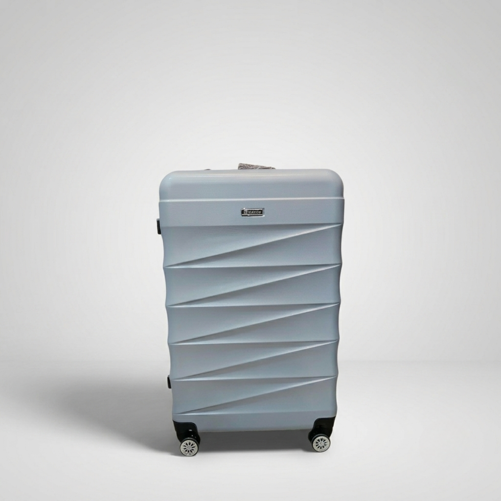 Unicare burgundy textured hard shell spinner trolley bag with geometric diagonal grooves.